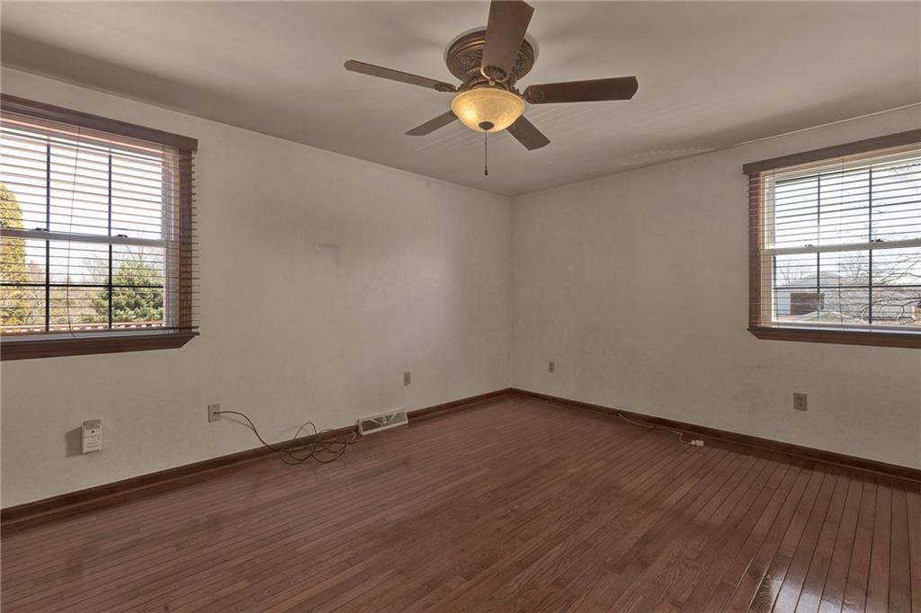 4930 Dutch Ridge Road Brighton Township, PA 15009 - Photo 15 of 25 a view of an empty room with wooden floor and a window