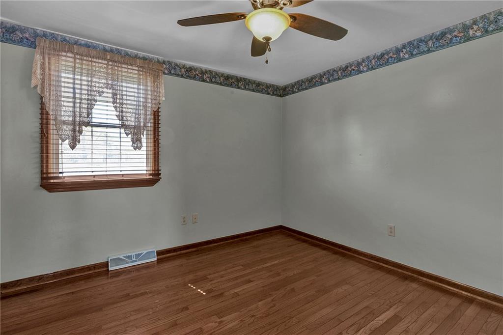 4930 Dutch Ridge Road Brighton Township, PA 15009 - Photo 17 of 25 a view of an empty room with wooden floor and a window