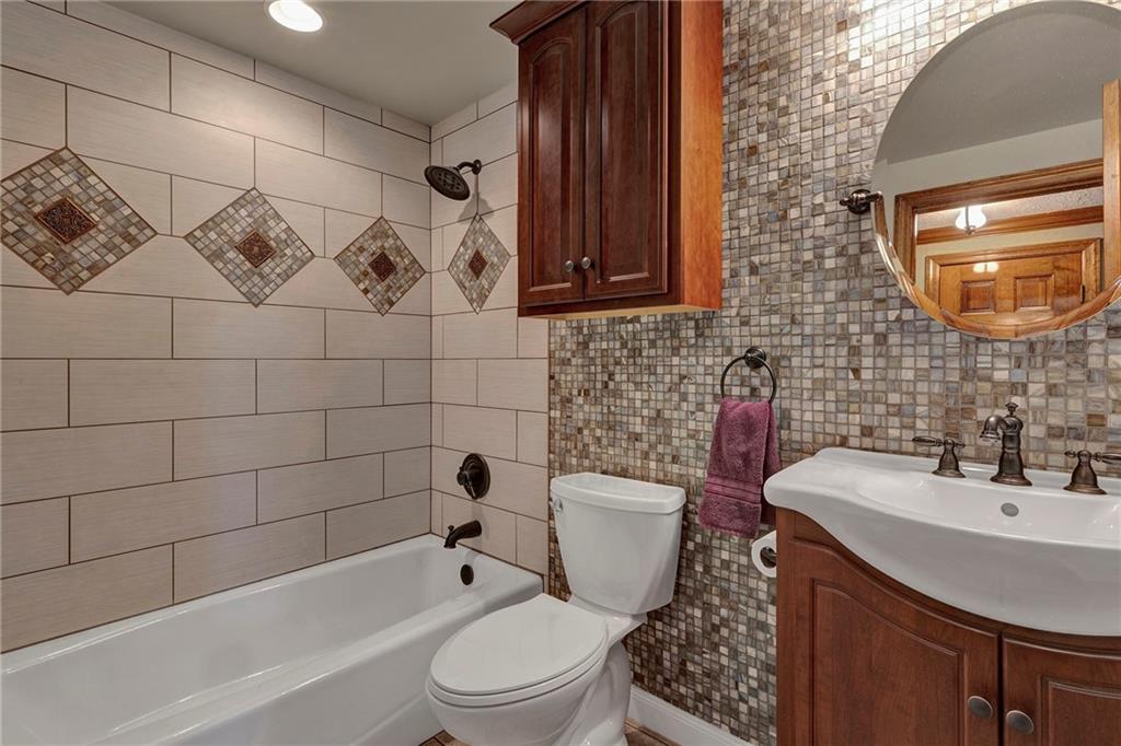 4930 Dutch Ridge Road Brighton Township, PA 15009 - Photo 19 of 25 a bathroom with a sink a toilet and shower
