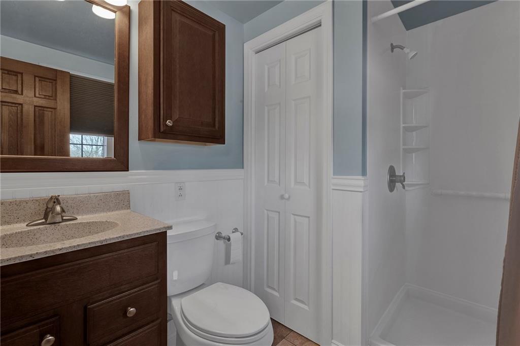 4930 Dutch Ridge Road Brighton Township, PA 15009 - Photo 20 of 25 a bathroom with a sink a toilet and shower