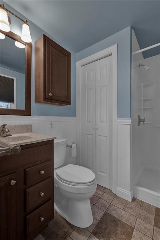 4930 Dutch Ridge Road Brighton Township, PA 15009 - Photo 21 of 25 a bathroom with a toilet sink vanity and mirror