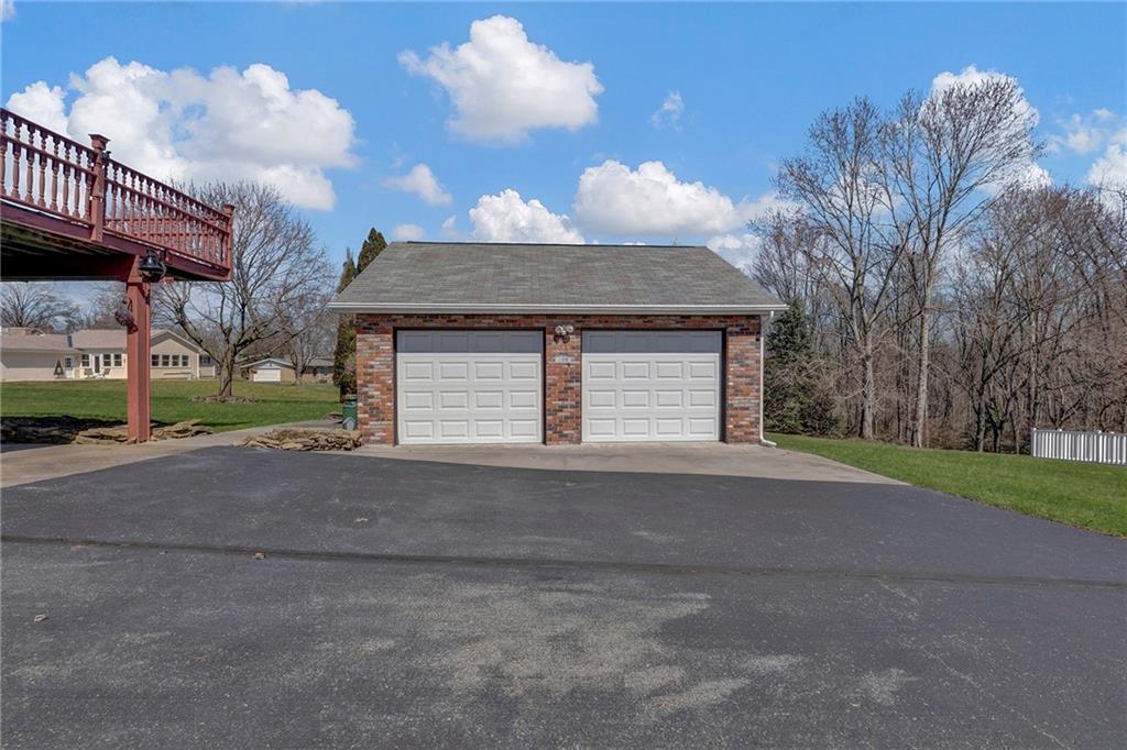4930 Dutch Ridge Road Brighton Township, PA 15009 - Photo 3 of 25 a front view of a house with a yard and garage