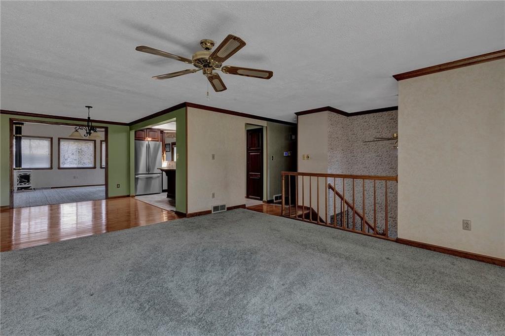 4930 Dutch Ridge Road Brighton Township, PA 15009 - Photo 6 of 25 a view of a livingroom with a ceiling fan