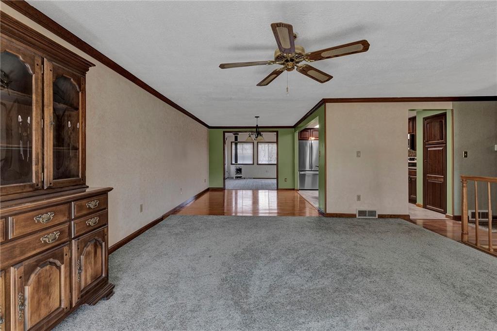 4930 Dutch Ridge Road Brighton Township, PA 15009 - Photo 7 of 25 a view of a livingroom with a ceiling fan