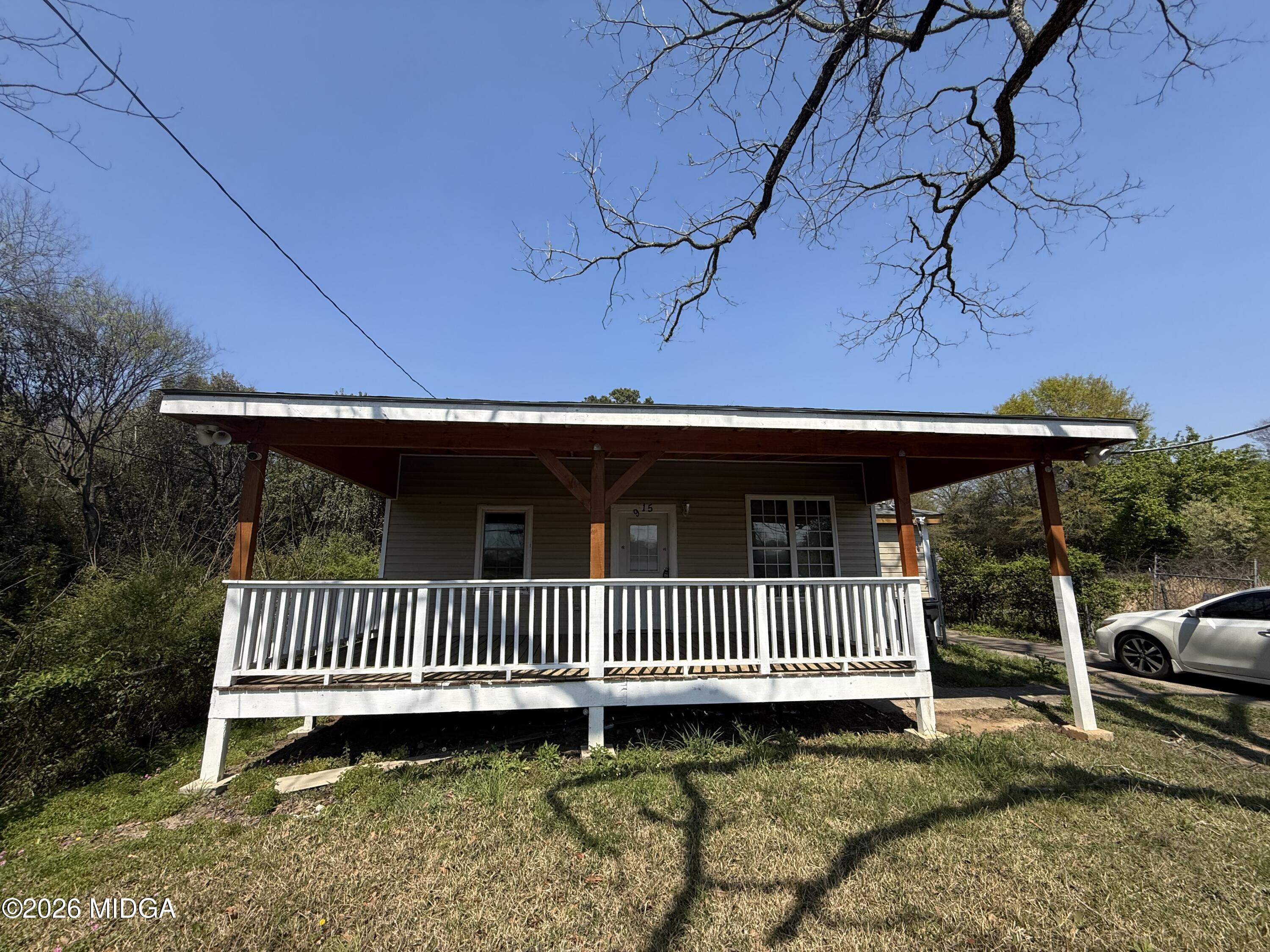 a view of a porch with a yard