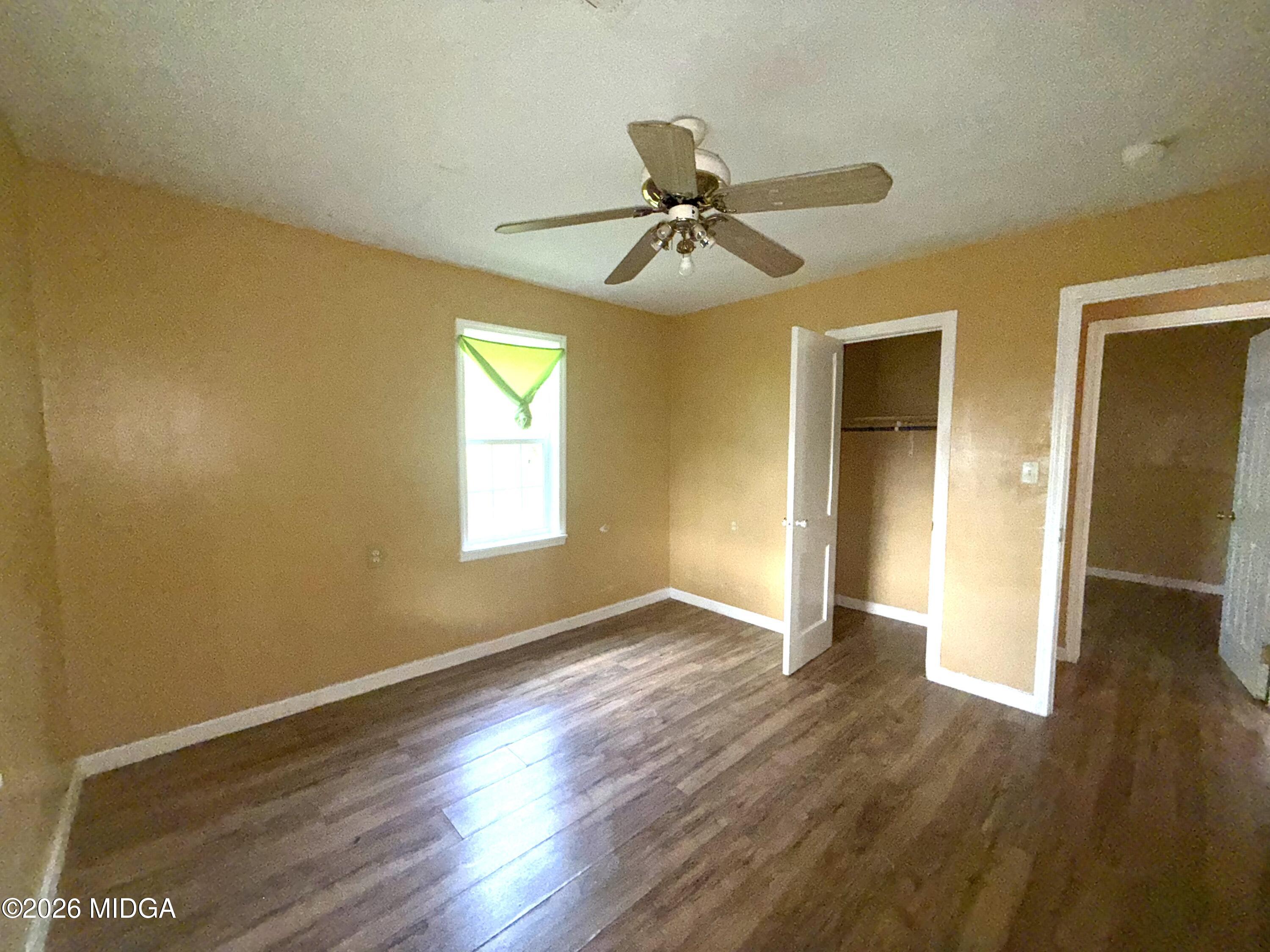 615 Paul Street Macon, GA 31206 - Photo 11 of 24 a view of empty room with wooden floor and fan