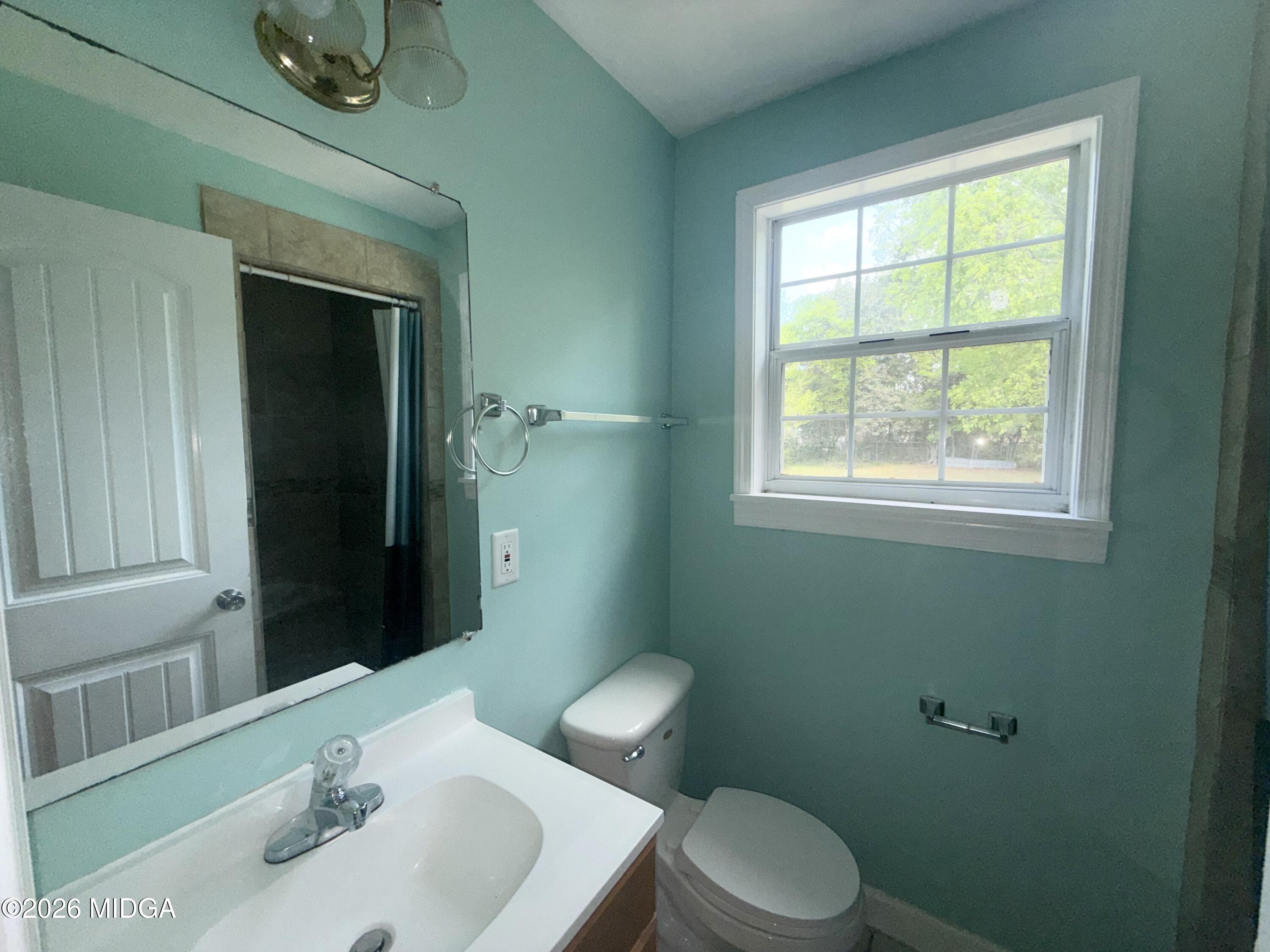 615 Paul Street Macon, GA 31206 - Photo 15 of 24 a bathroom with a sink and a toilet