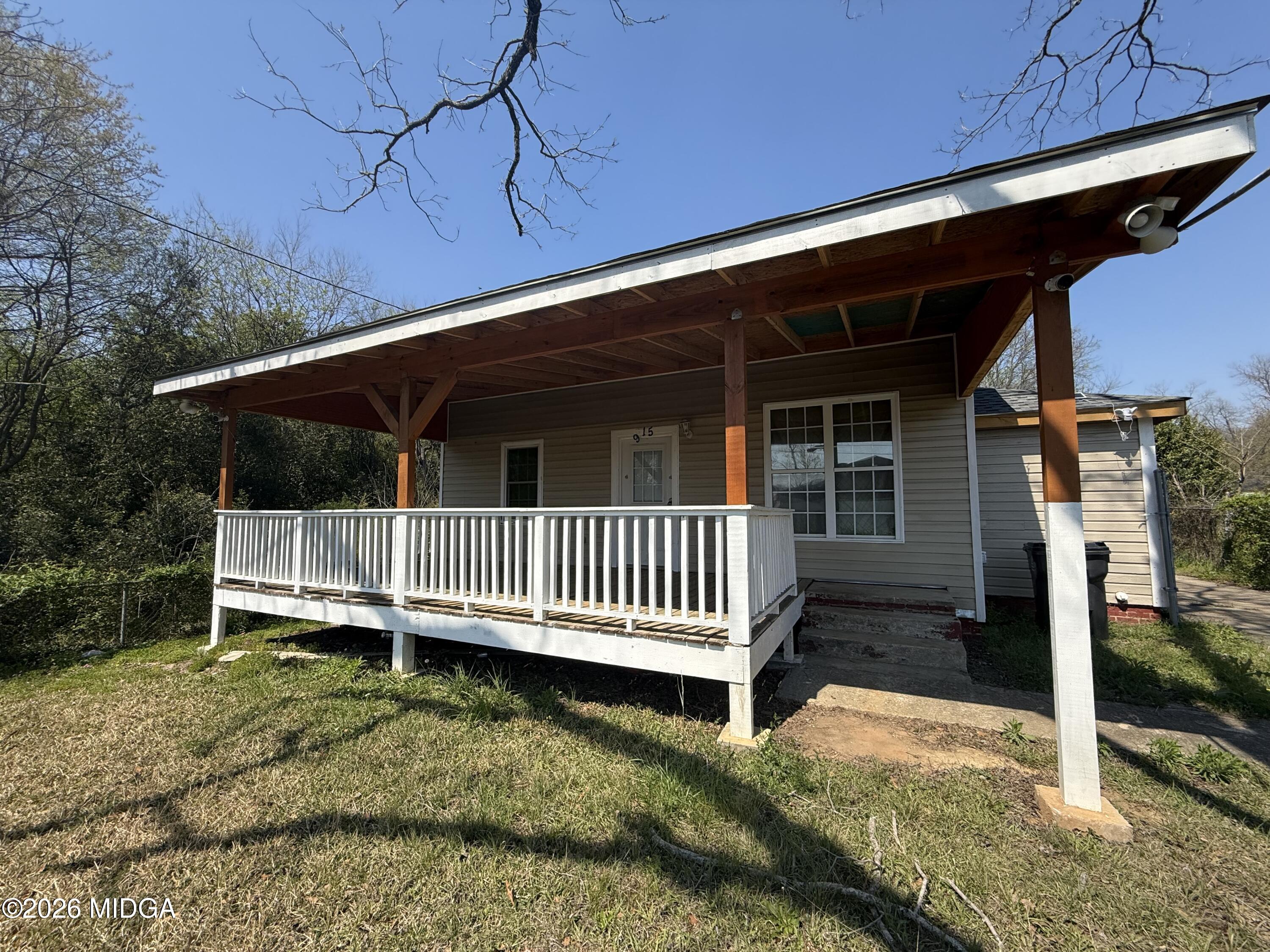 615 Paul Street Macon, GA 31206 - Photo 4 of 24 a view of a house with a yard and wooden fence