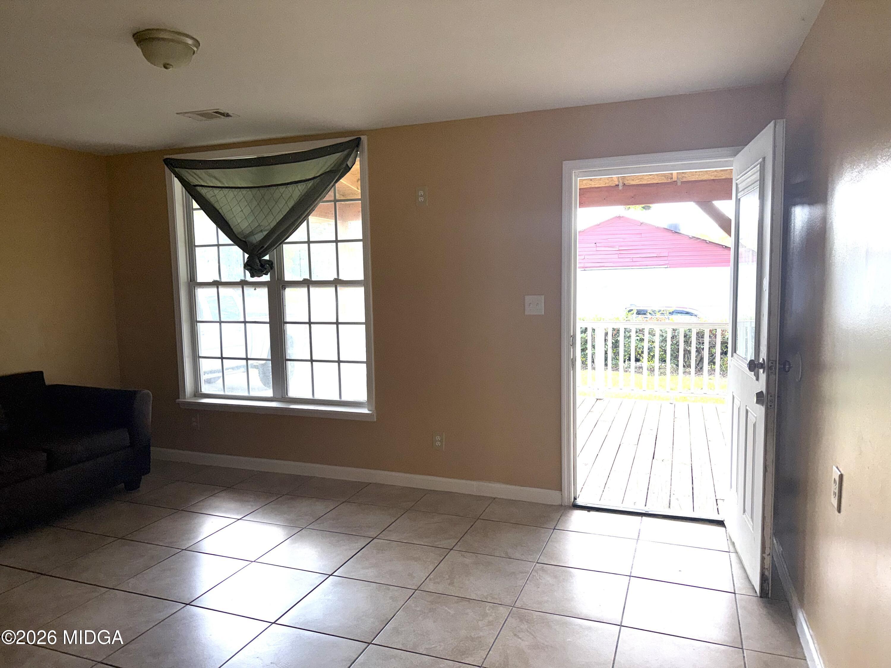 615 Paul Street Macon, GA 31206 - Photo 6 of 24 a view of an empty room with a window