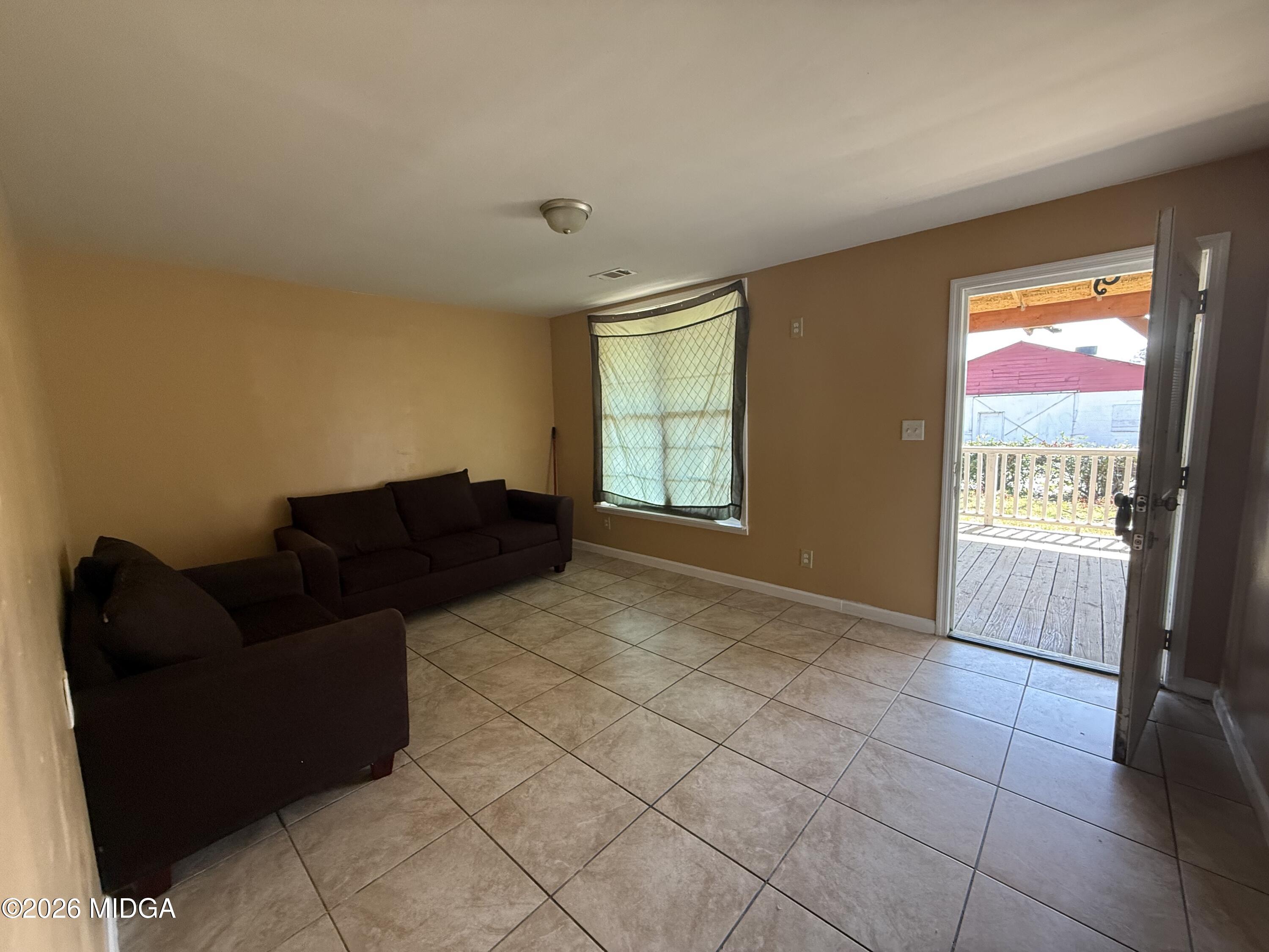 615 Paul Street Macon, GA 31206 - Photo 7 of 24 a living room with furniture and a window