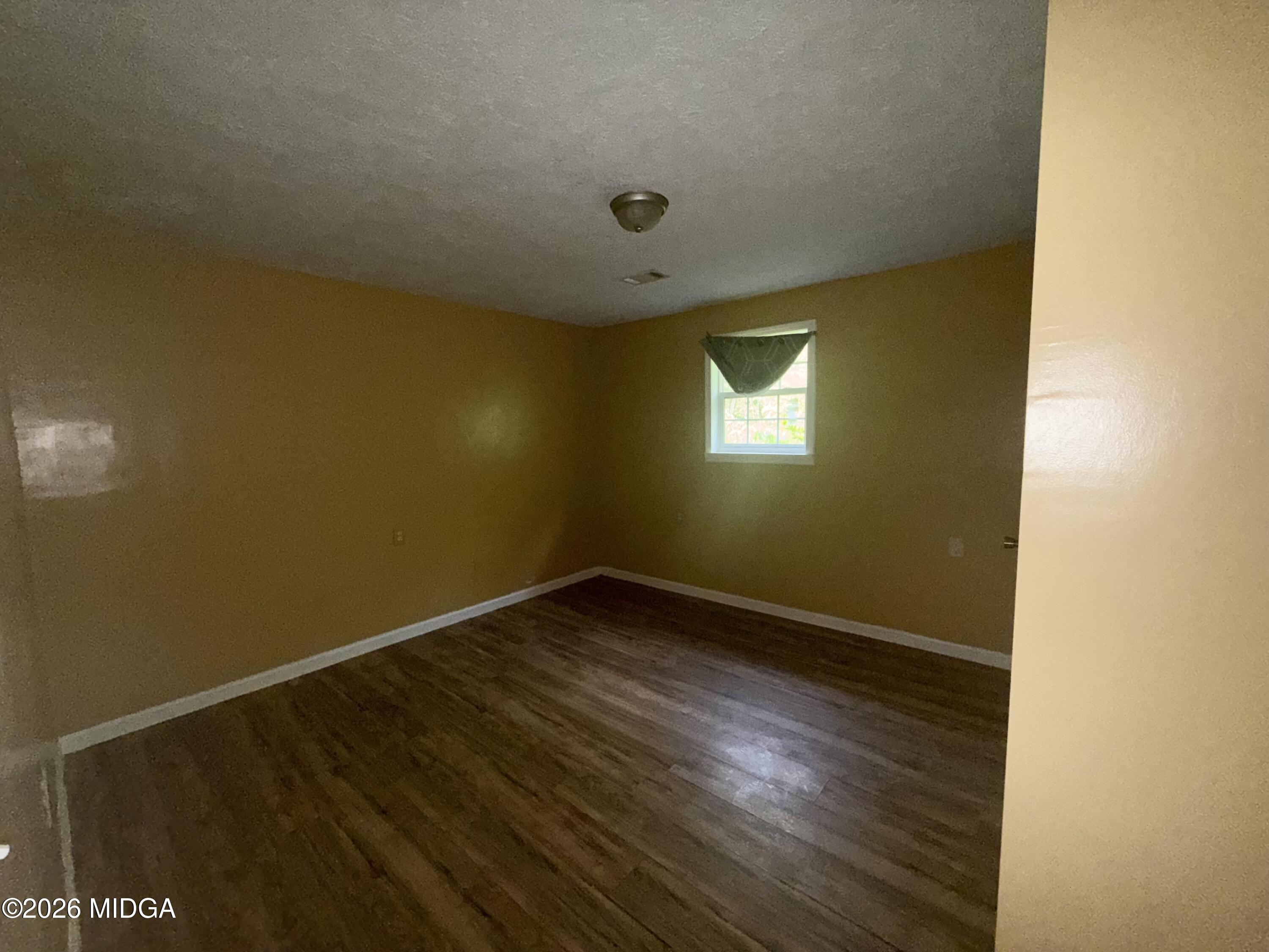 615 Paul Street Macon, GA 31206 - Photo 9 of 24 an empty room with a window