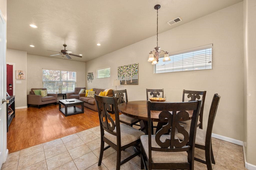 2436 1/2 Jack Creek Road Grand Junction, CO 81505 - Photo 12 of 36 a view of a dining room with furniture and a chandelier