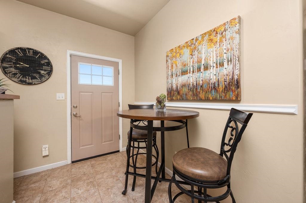 2436 1/2 Jack Creek Road Grand Junction, CO 81505 - Photo 13 of 36 a view of a dining room with furniture and window