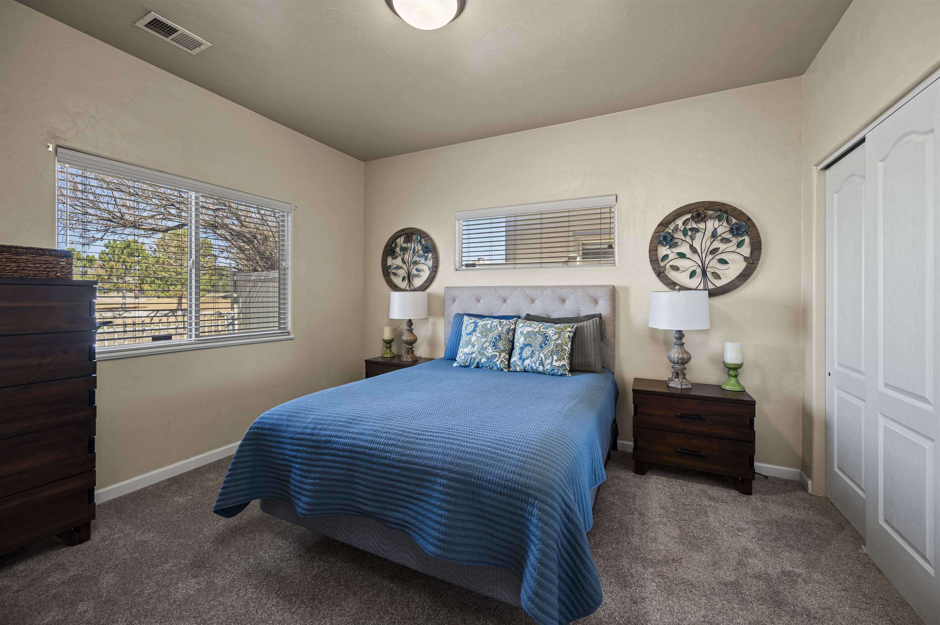 2436 1/2 Jack Creek Road Grand Junction, CO 81505 - Photo 15 of 36 a bedroom with a bed and a table