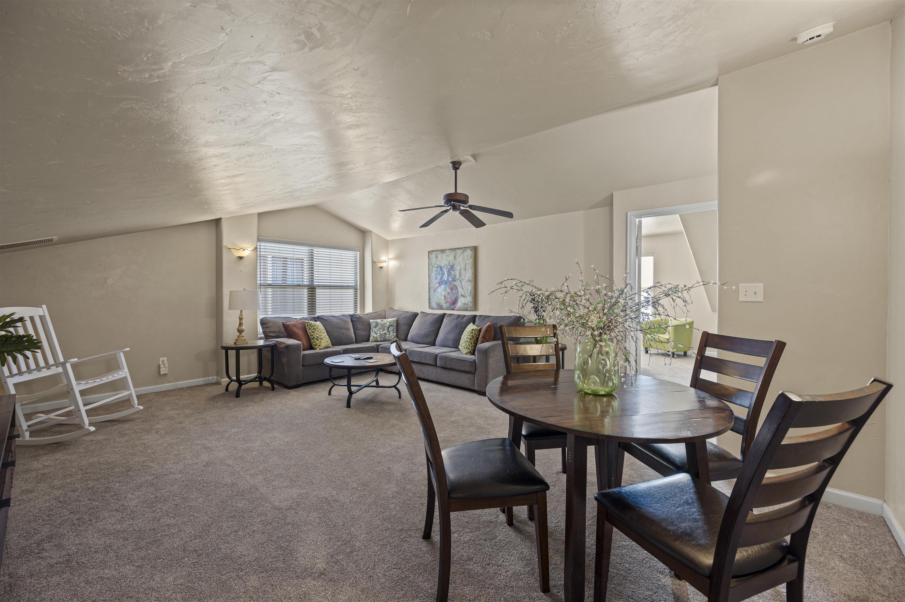 2436 1/2 Jack Creek Road Grand Junction, CO 81505 - Photo 21 of 36 a view of a dining room with furniture and a livingroom