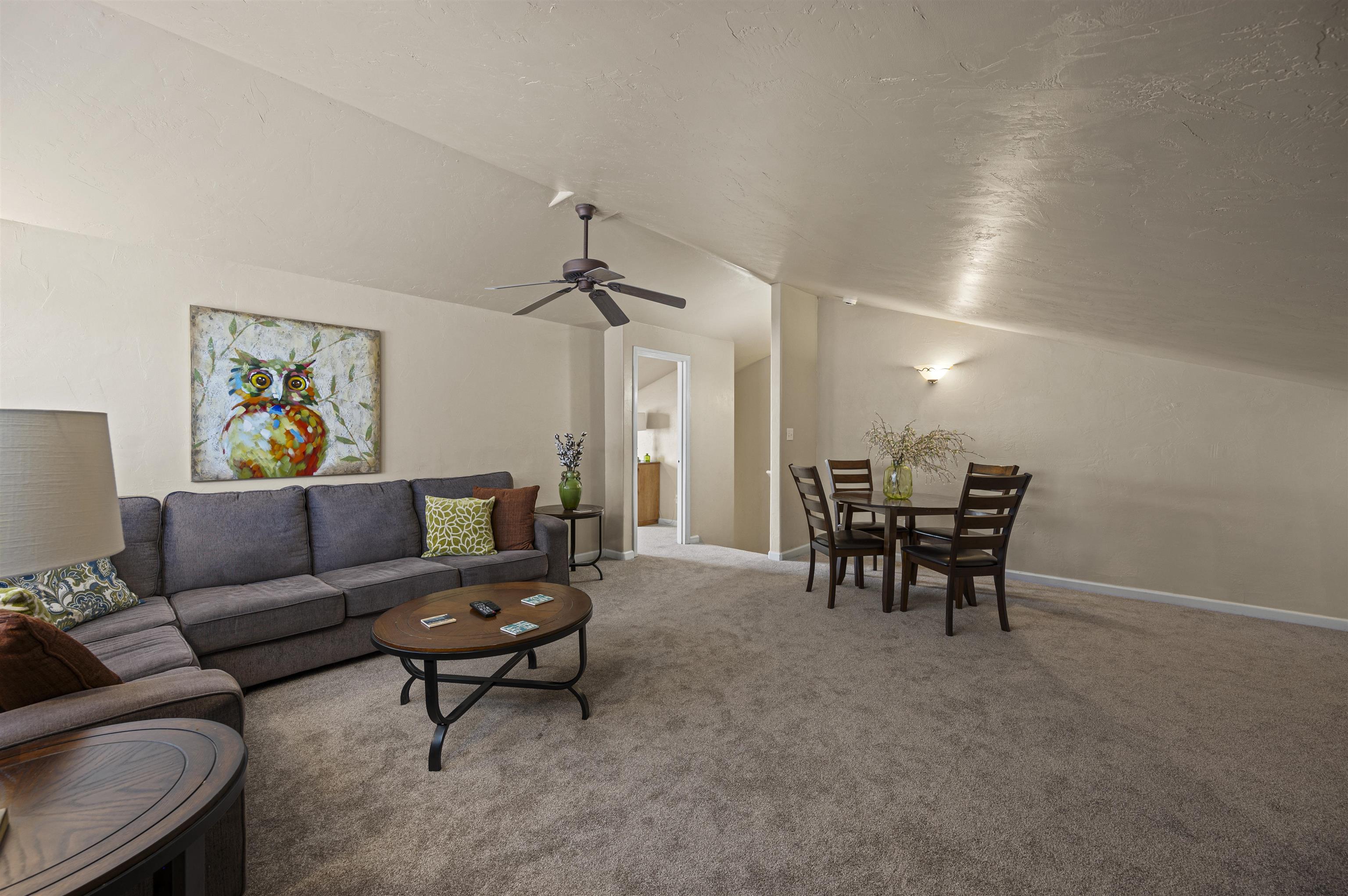2436 1/2 Jack Creek Road Grand Junction, CO 81505 - Photo 22 of 36 a living room with furniture and a ceiling fan