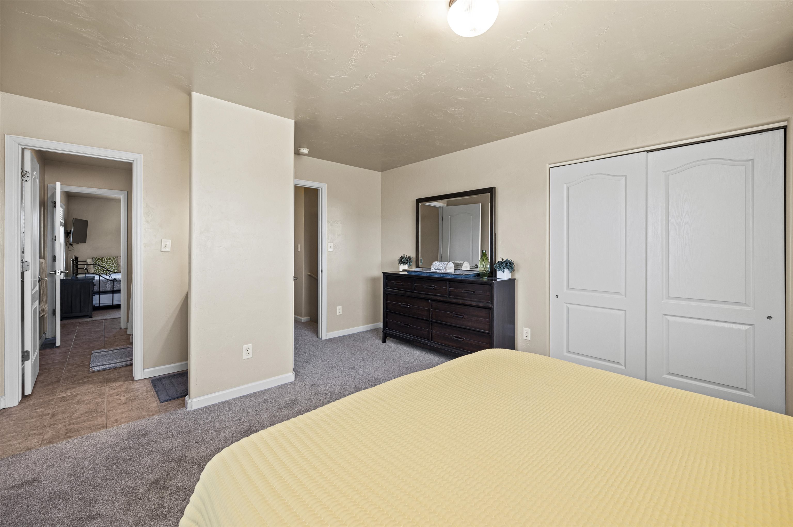 2436 1/2 Jack Creek Road Grand Junction, CO 81505 - Photo 26 of 36 a bedroom with a bed and a television