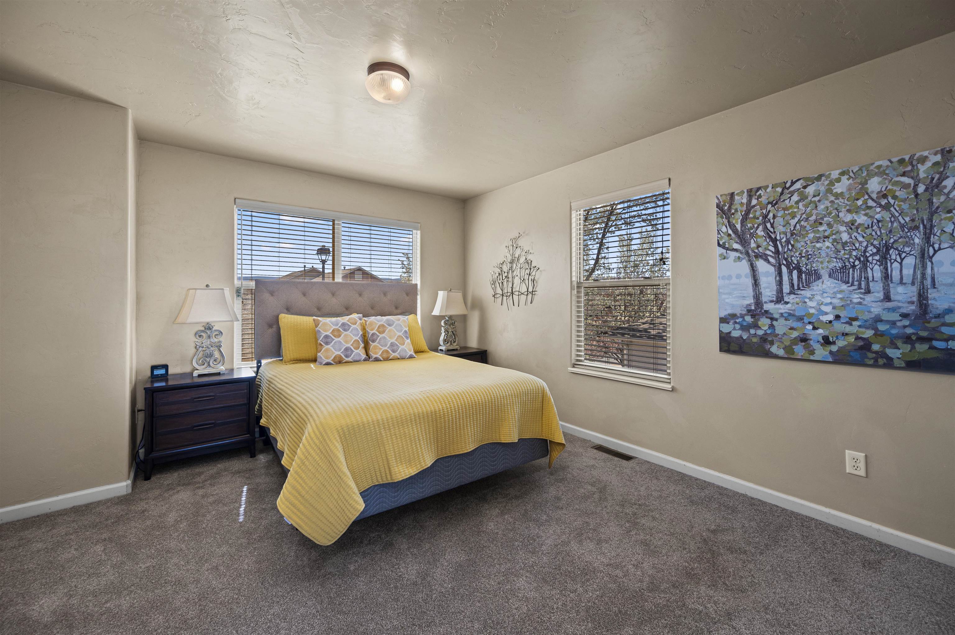2436 1/2 Jack Creek Road Grand Junction, CO 81505 - Photo 27 of 36 a bedroom with a bed and window