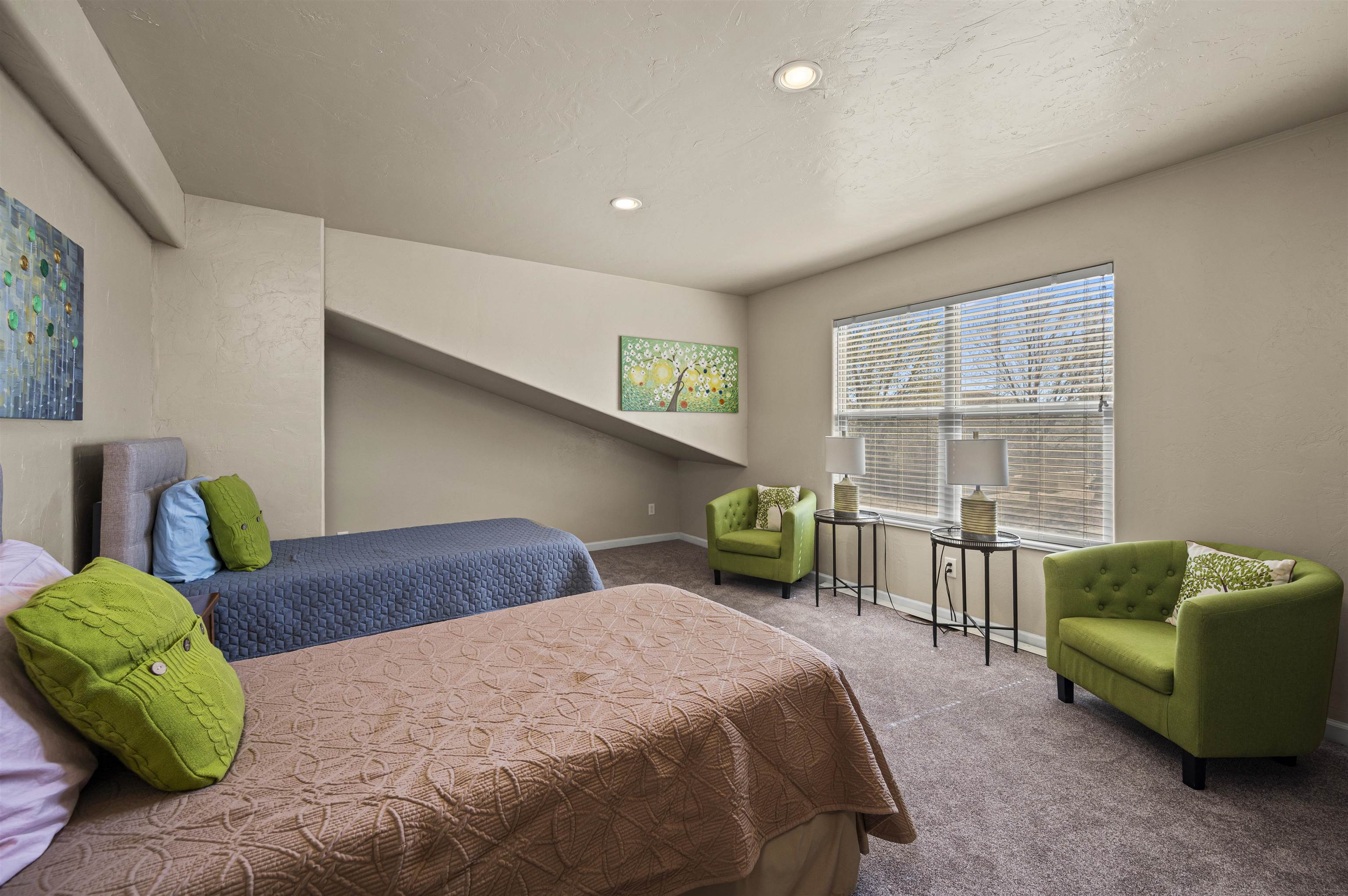 2436 1/2 Jack Creek Road Grand Junction, CO 81505 - Photo 28 of 36 a bedroom with a bed and a couch