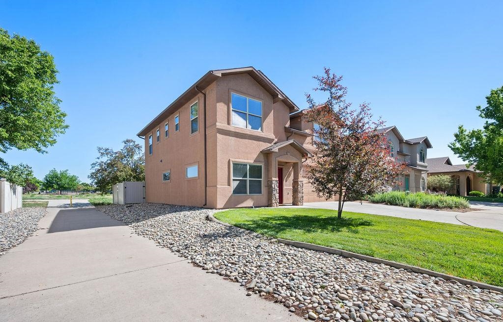 2436 1/2 Jack Creek Road Grand Junction, CO 81505 - Photo 3 of 36 a front view of house with yard and green space