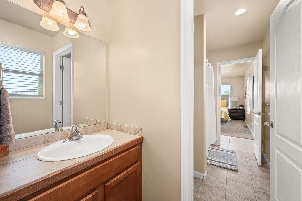 2436 1/2 Jack Creek Road Grand Junction, CO 81505 - Photo 32 of 36 a en suite bathroom with a sink and a mirror