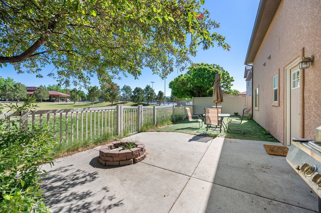 2436 1/2 Jack Creek Road Grand Junction, CO 81505 - Photo 35 of 36 a view of a backyard with couches plants and large tree