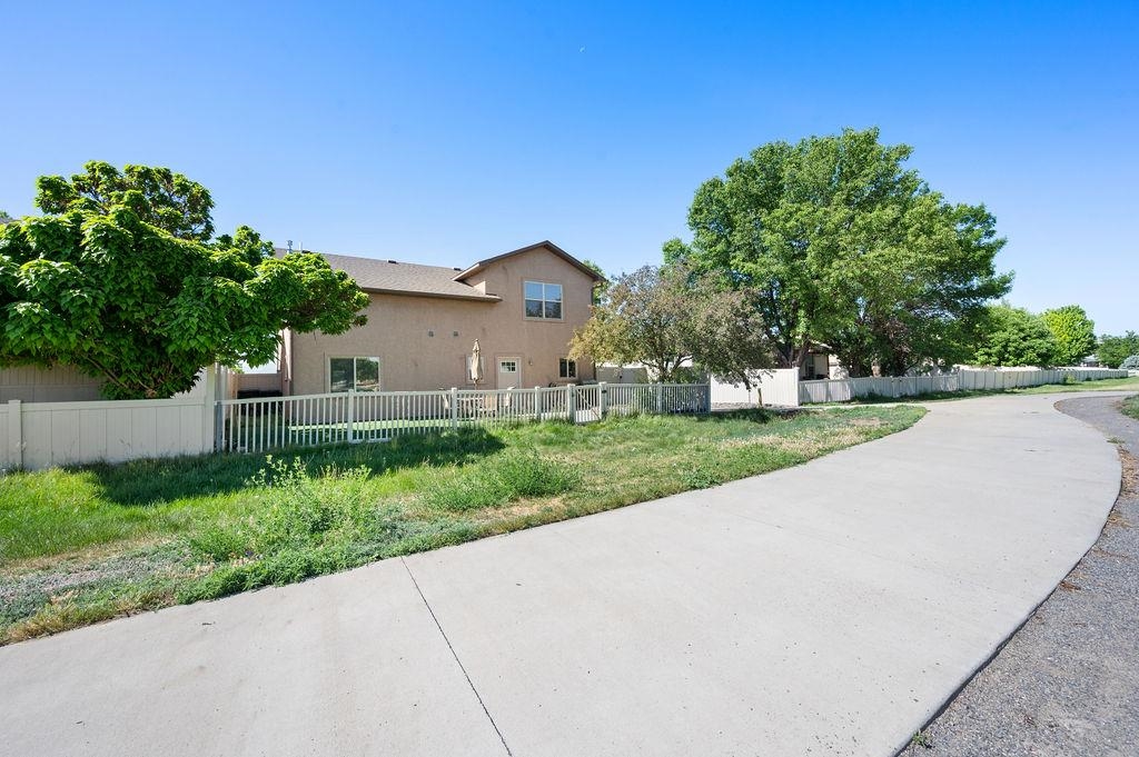 2436 1/2 Jack Creek Road Grand Junction, CO 81505 - Photo 36 of 36 a view of a house with a yard