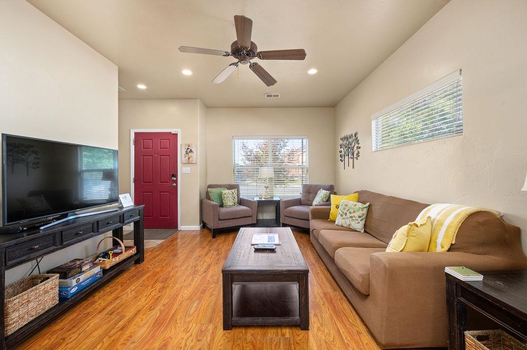 2436 1/2 Jack Creek Road Grand Junction, CO 81505 - Photo 4 of 36 a living room with furniture and a flat screen tv