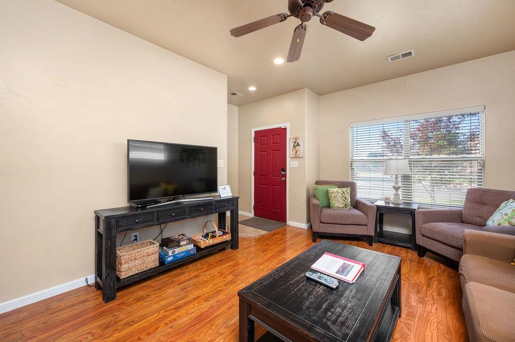2436 1/2 Jack Creek Road Grand Junction, CO 81505 - Photo 5 of 36 a living room with furniture and a flat screen tv