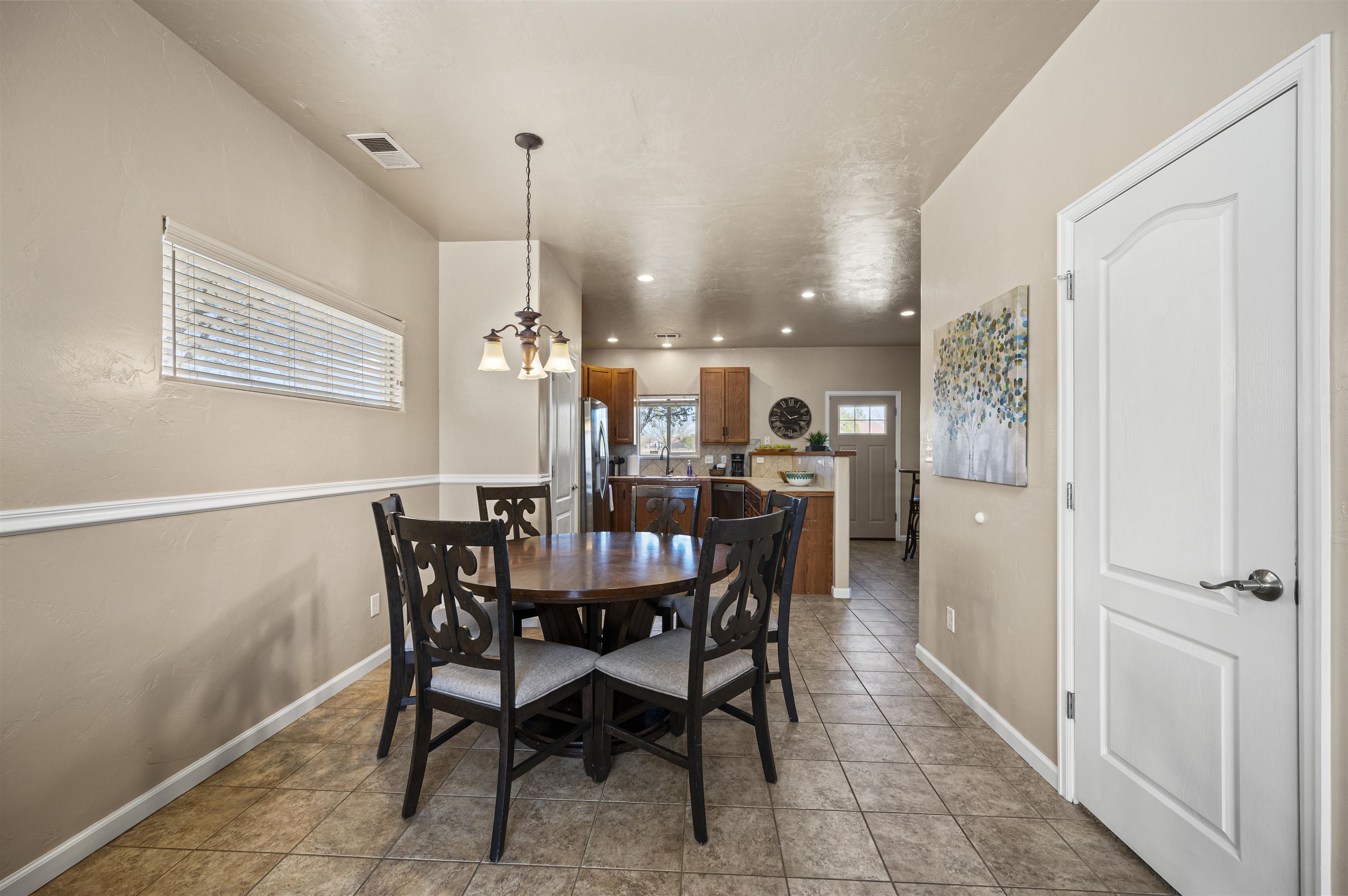 2436 1/2 Jack Creek Road Grand Junction, CO 81505 - Photo 10 of 36 a view of a dining room with furniture