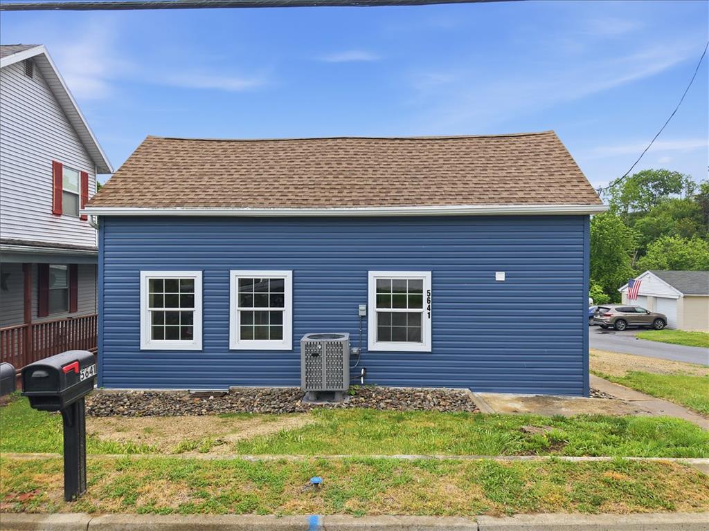 5641 North Coplay Road Whitehall, PA 18052 - Photo 63 of 68 A charming blue residence with a classic brown shingle roof awaits its new owner.