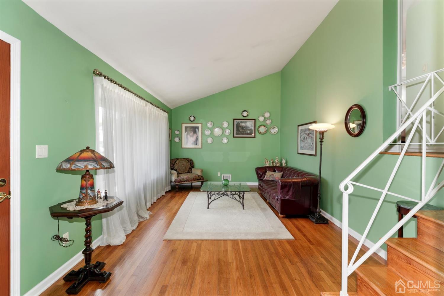 49 Albemarle Road Colonia, NJ 07067 - Photo 3 of 20 a living room with furniture and a table