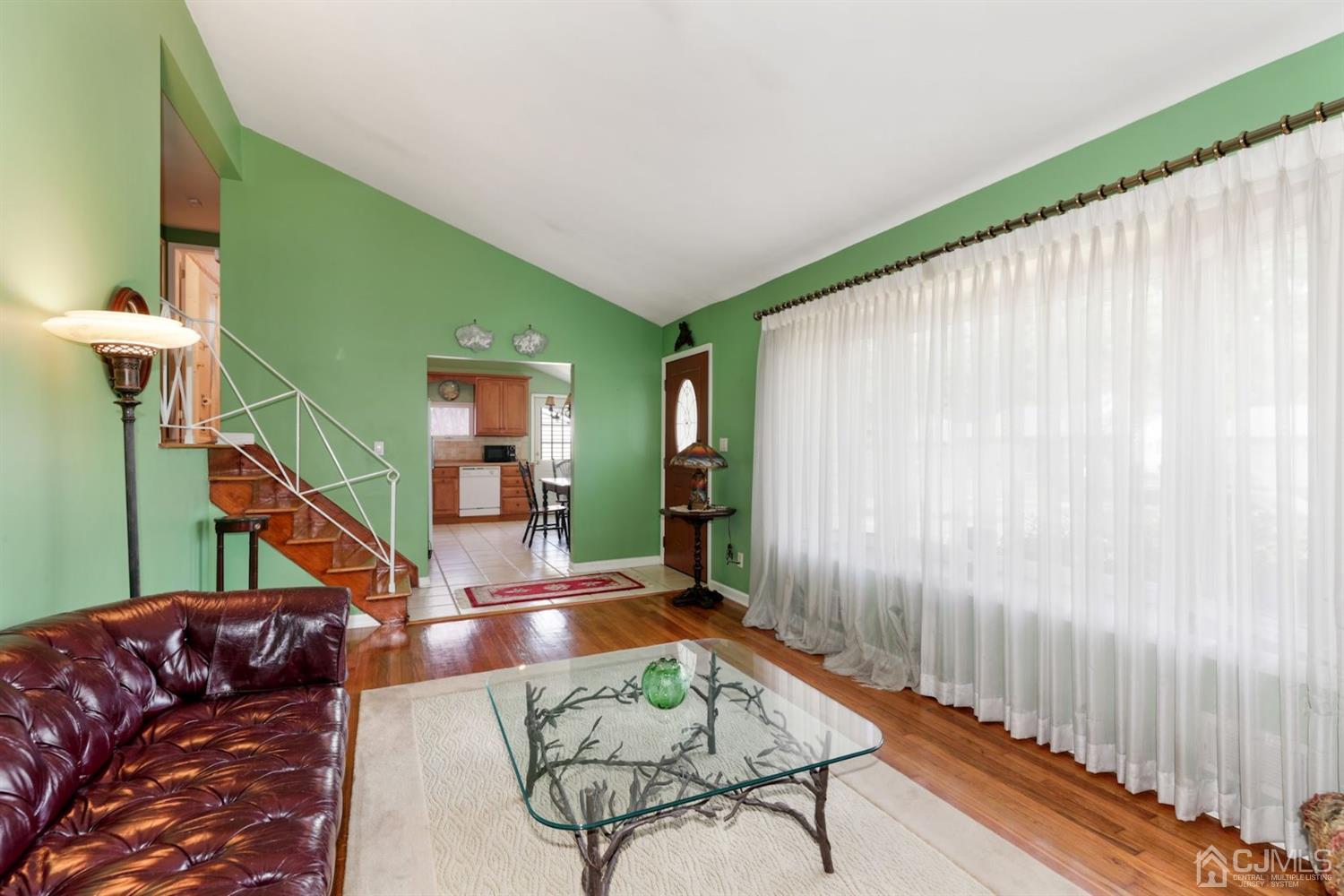 49 Albemarle Road Colonia, NJ 07067 - Photo 4 of 20 a living room with furniture and a wooden floor