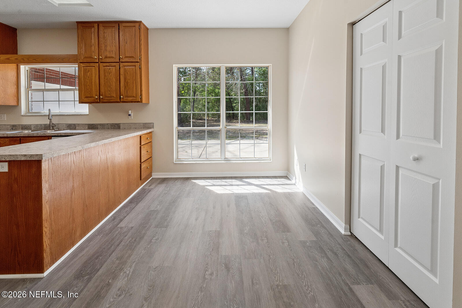 6240 Payne Road Keystone Heights, FL 32656 - Photo 17 of 43 a view of a kitchen with wooden floor and a sink
