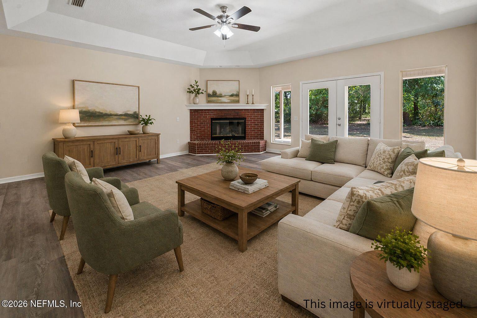 6240 Payne Road Keystone Heights, FL 32656 - Photo 23 of 43 a living room with furniture and a fireplace
