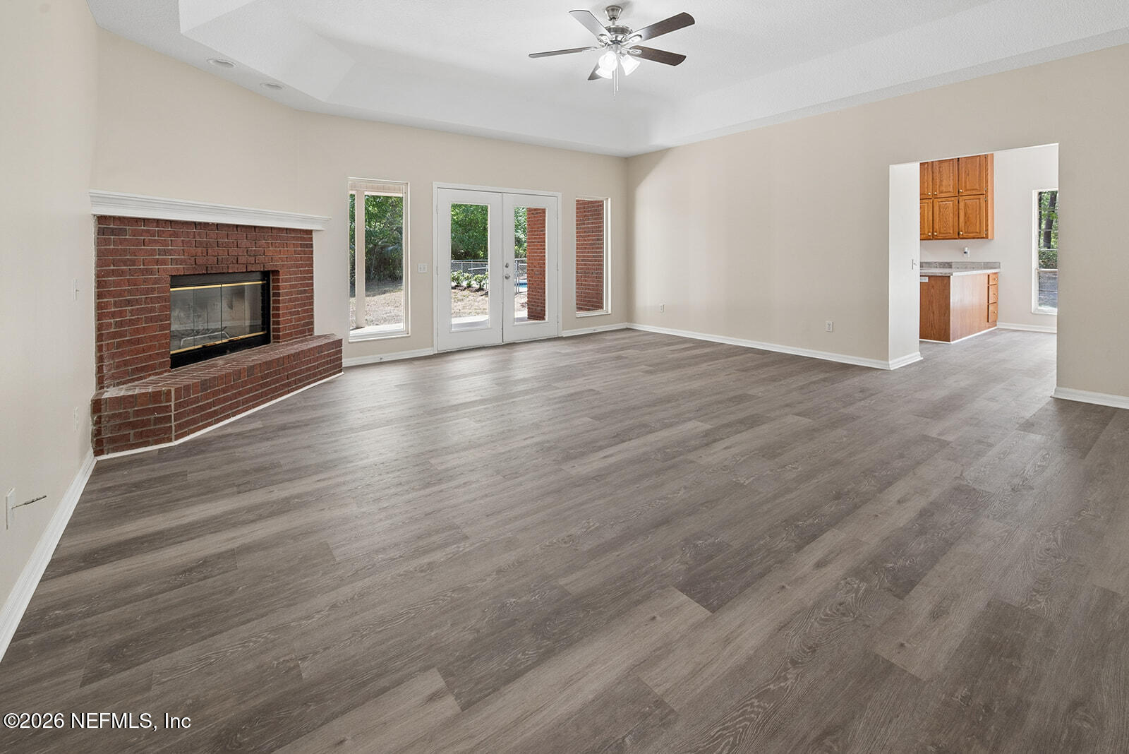 6240 Payne Road Keystone Heights, FL 32656 - Photo 25 of 43 a view of an empty room with a fireplace and a window