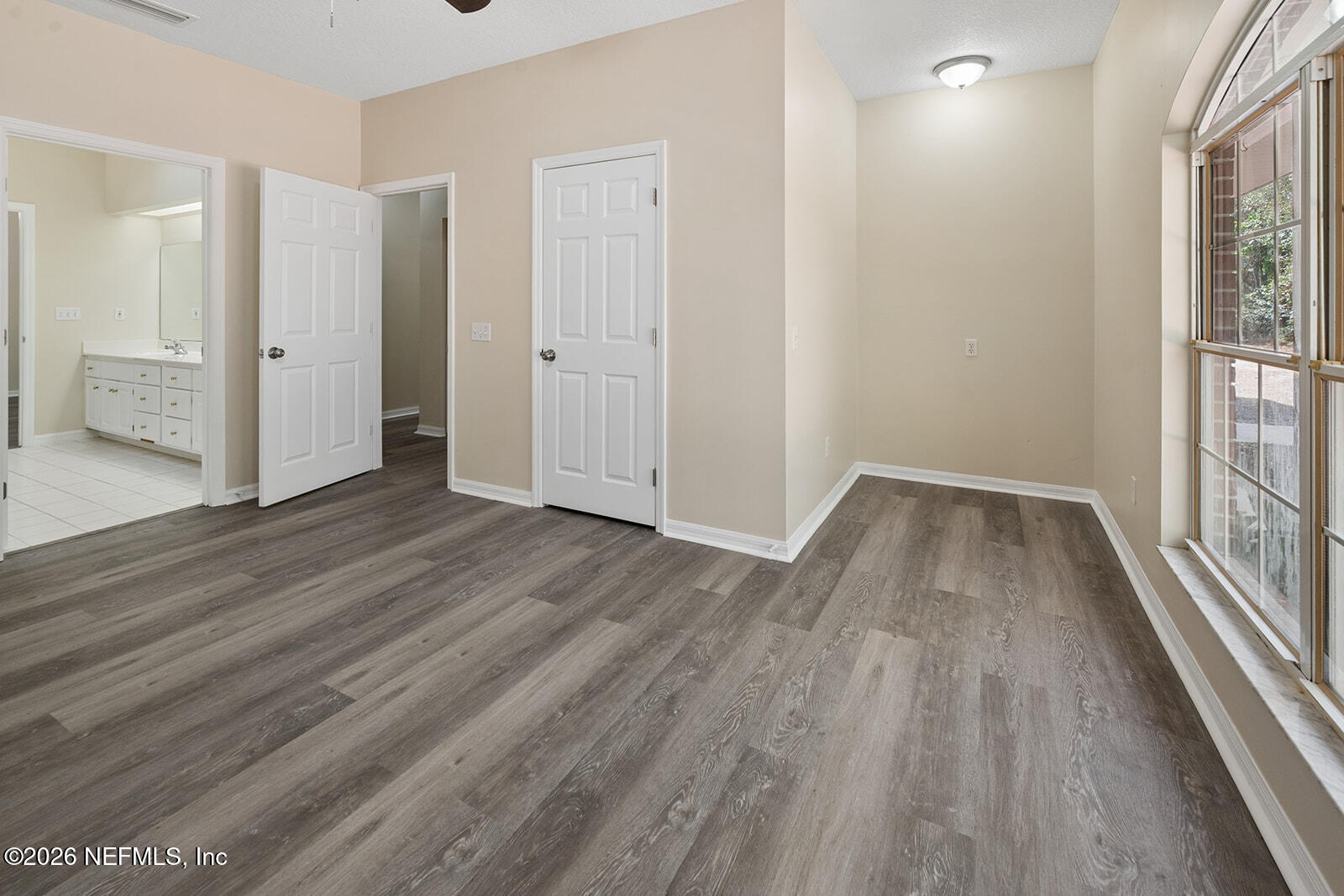 6240 Payne Road Keystone Heights, FL 32656 - Photo 27 of 43 wooden floor in an empty room with a window