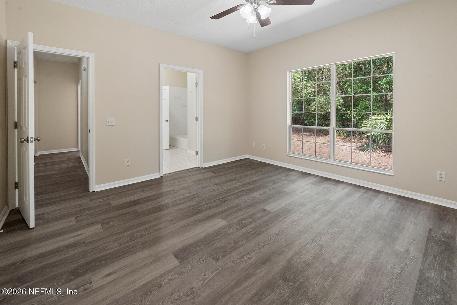 6240 Payne Road Keystone Heights, FL 32656 - Photo 31 of 43 wooden floor in an empty room with a window