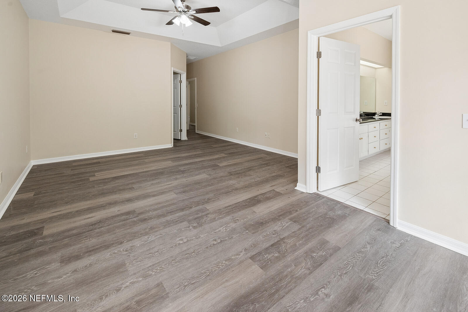 6240 Payne Road Keystone Heights, FL 32656 - Photo 34 of 43 an empty room with wooden floor and a ceiling fan