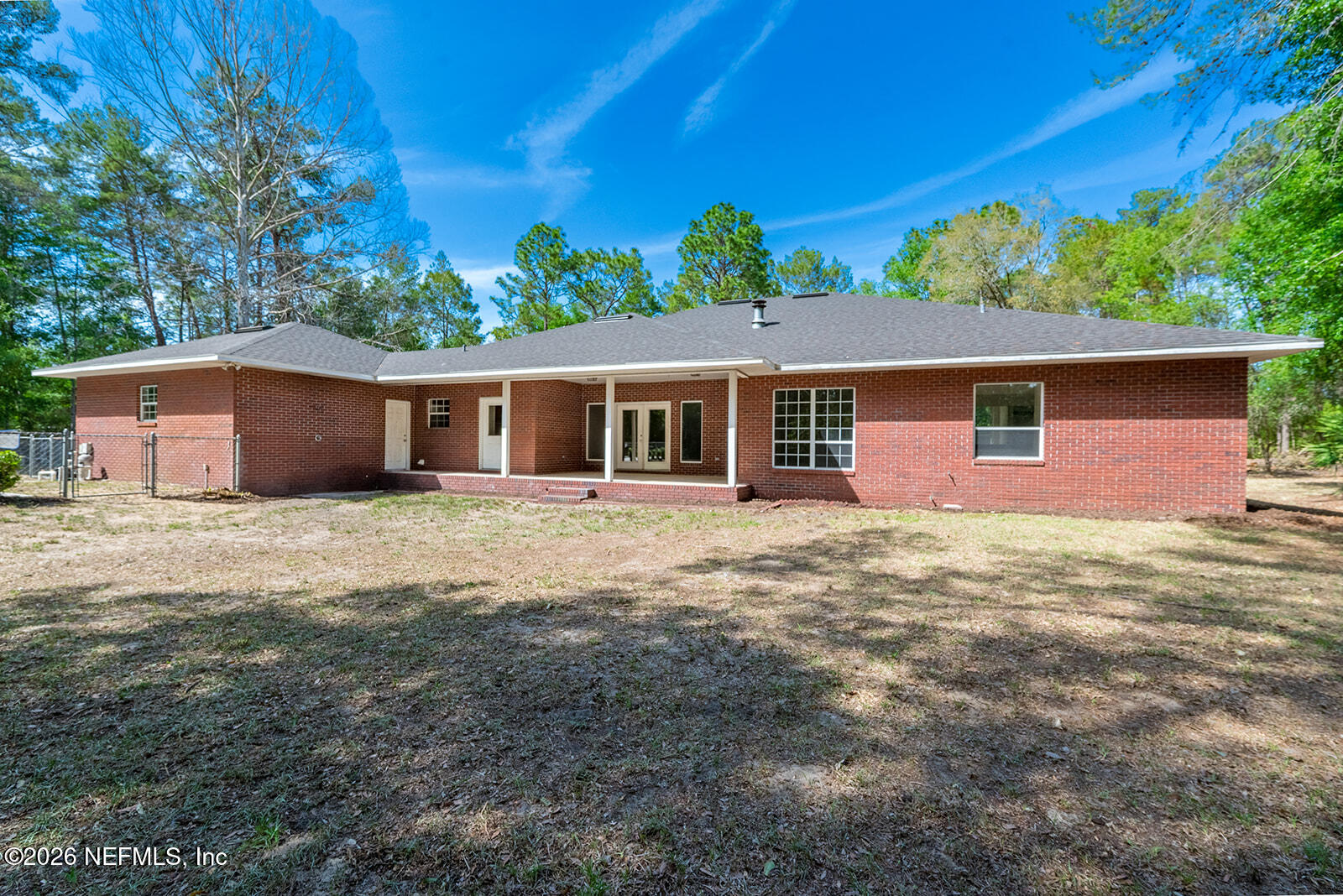 6240 Payne Road Keystone Heights, FL 32656 - Photo 38 of 43 a front view of a house with a garden