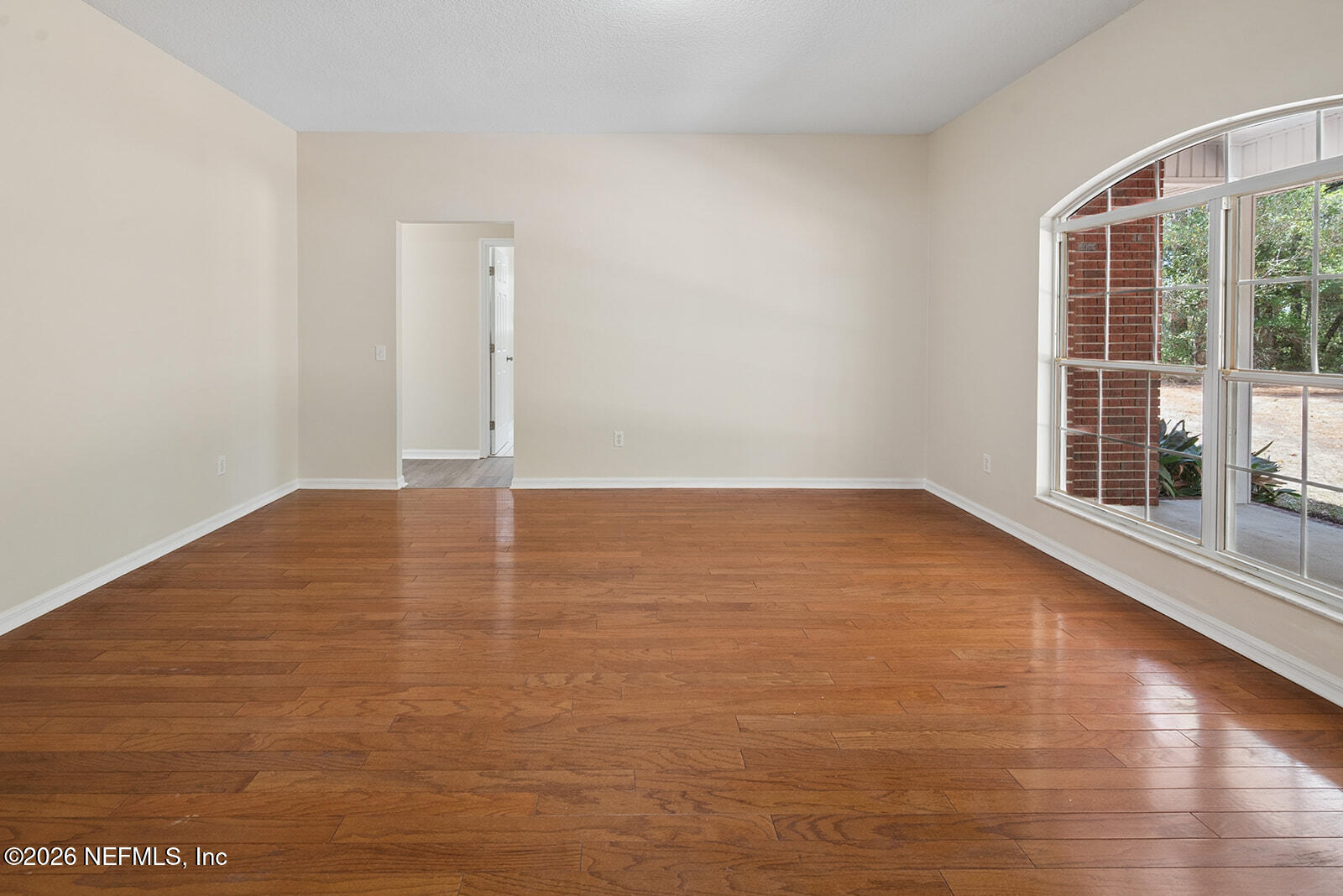 6240 Payne Road Keystone Heights, FL 32656 - Photo 7 of 43 a view of empty room with wooden floor and fan