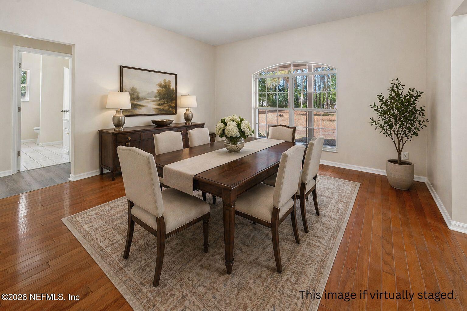 6240 Payne Road Keystone Heights, FL 32656 - Photo 8 of 43 a view of a dining room with furniture and wooden floor