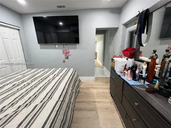 a room with furniture and a flat screen tv