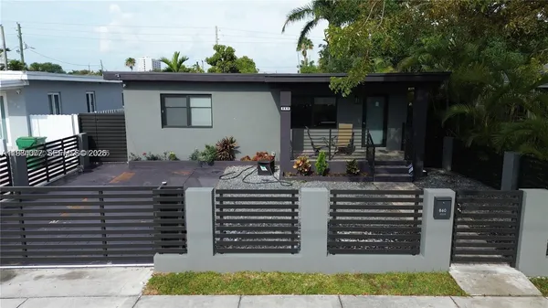 a view of a porch with furniture and a parking