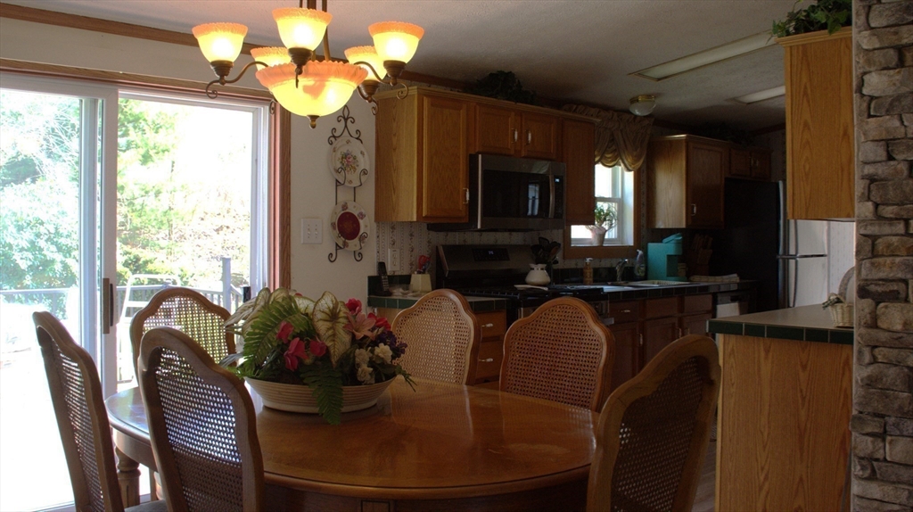 20 Deer Run Brookfield, MA 01506 - Photo 7 of 29 a dining room with furniture and a fireplace