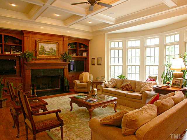 3032 Cone Manor Lane Raleigh, NC 27613 - Photo 4 of 12 a living room with furniture a fireplace and a flat screen tv