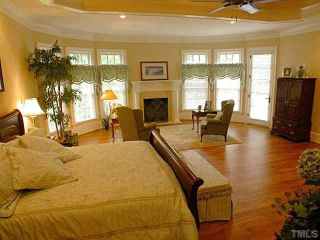 3032 Cone Manor Lane Raleigh, NC 27613 - Photo 8 of 12 a dining room with furniture and a fireplace