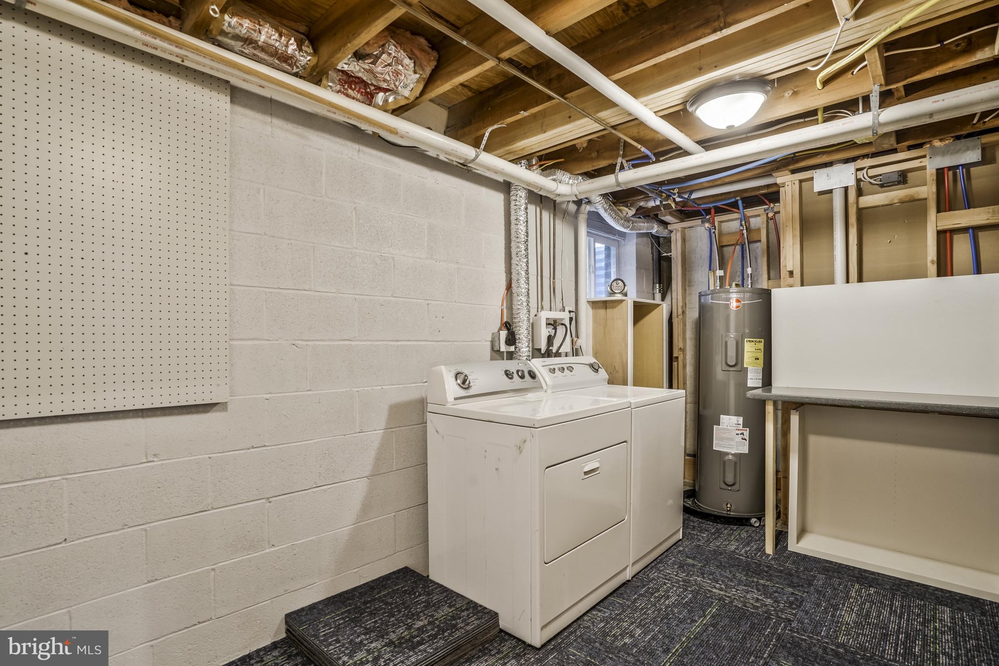 6910 Spur Road Springfield, VA 22153 - Photo 48 of 59 Laundry room with folding table on lower level