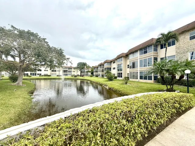 a view of a lake with a house in the background