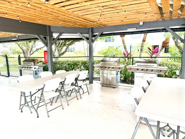 a view of a patio with a table chairs and a patio